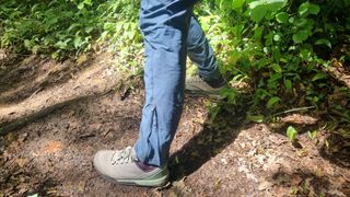 Close up of outside lower leg showing calf zip of Rab pants.