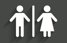 A sign indicates men's and women's bathrooms