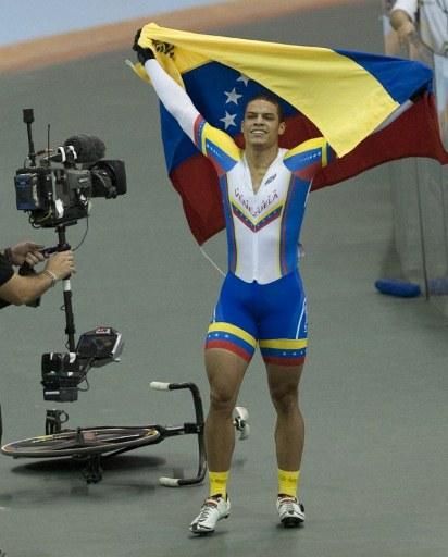 Hersony Gadiel Canelon (Venezuela) celebrates his gold medal in the sprint competition.