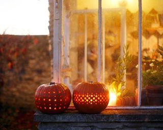 pumpkin lanterns with dot pattern on windowsill