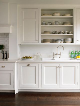 farmhouse style kitchen with cream shaker cabinets and open shelving