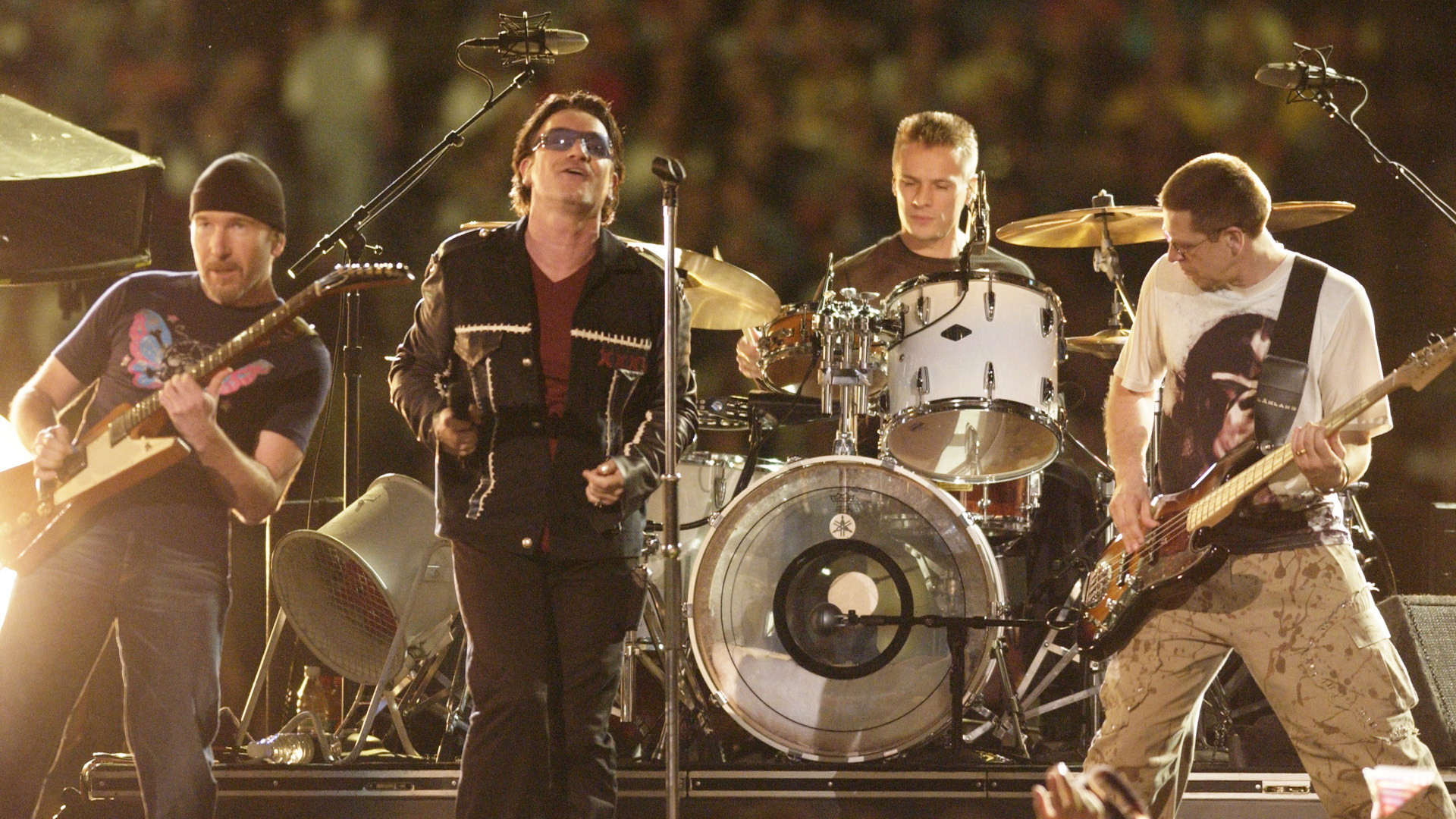 U2 performs during the halftime show at Super Bowl XXXVI in the Superdome, New Orleans, Louisiana, February 3, 2002.