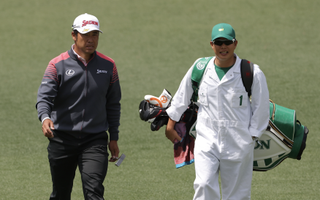 Hideki Matsuyama and his caddie at the 2022 Masters