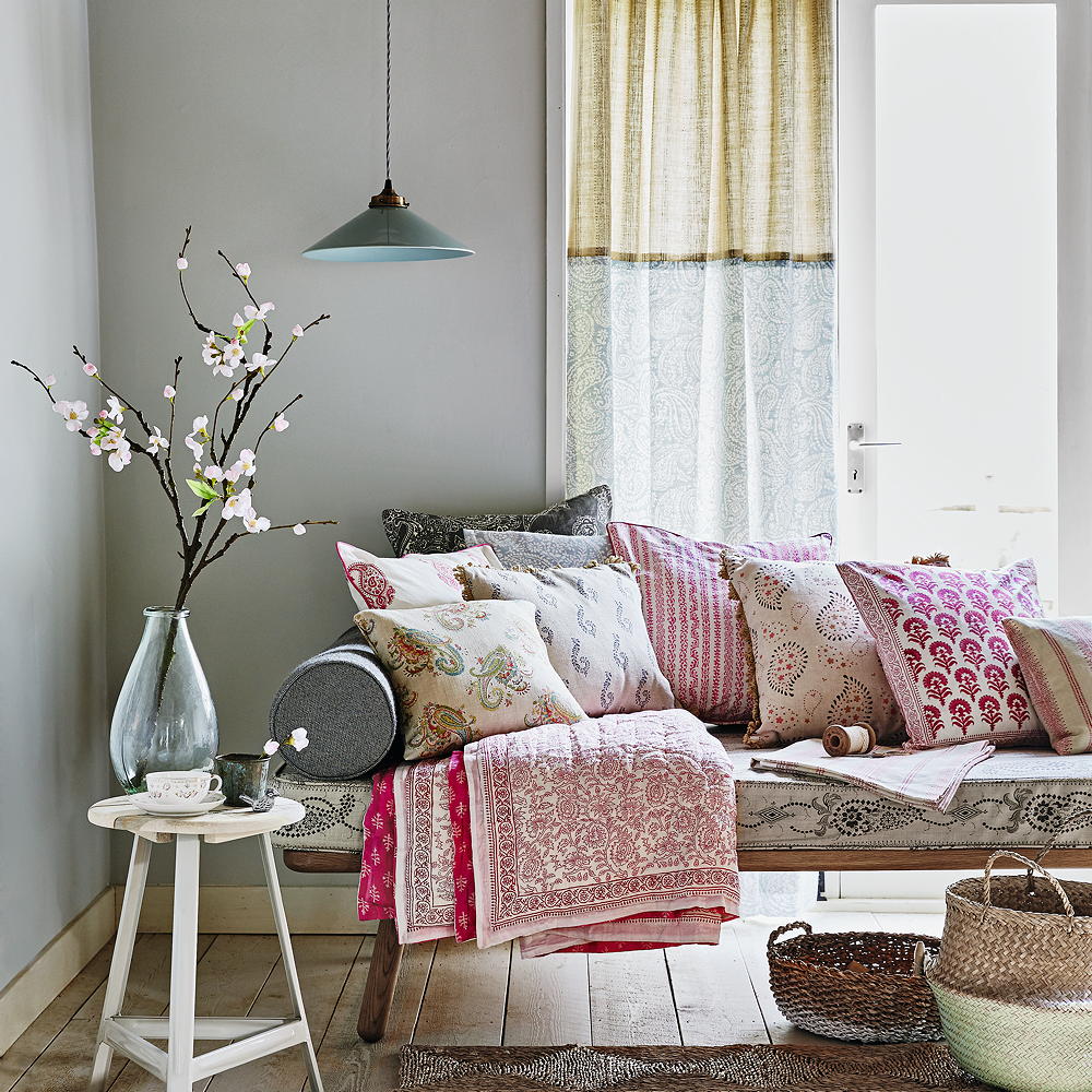 living room with sofa and cushions