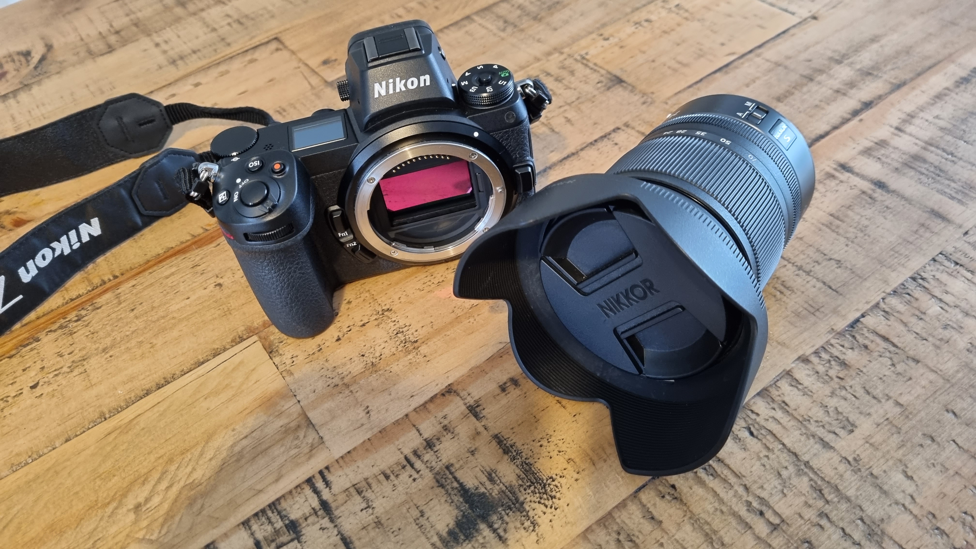 Nikon Z6 camera and lens on a wooden table