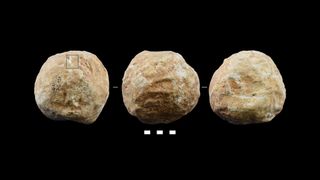 Different sides of a prehistoric stone crafted ball found at Qesem Cave in Israel. 