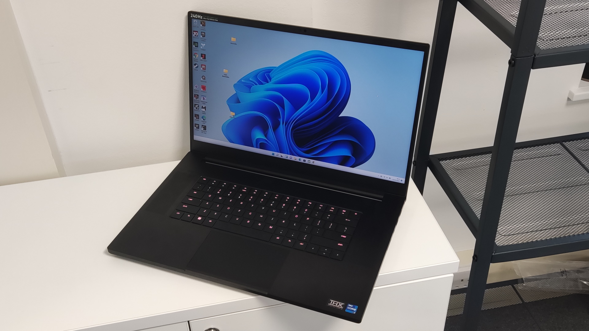 Image of Razer Blade 17 by a window.