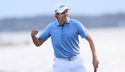 Matt Fitzpatrick fist pumps on the 18th green after winning a playoff