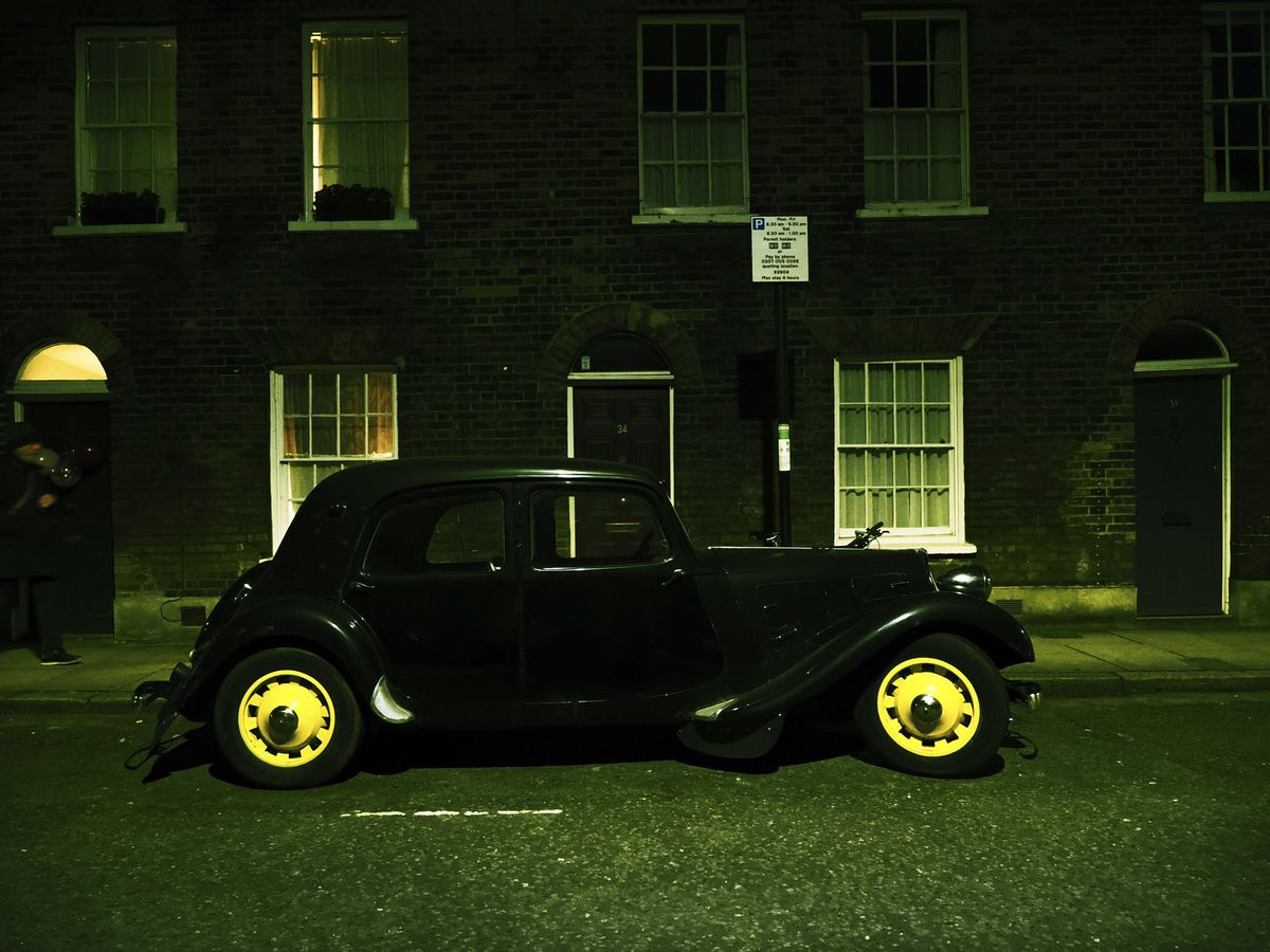 OM System OM-3 sample photos: classic car in quaint London street at night