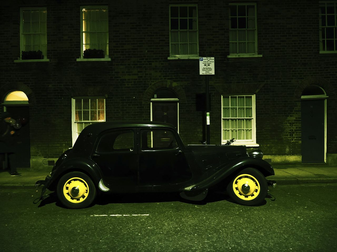 OM System OM-3 sample photos: classic car in quaint London street at night