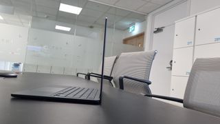 MacBook Air laptop in an office on a black desk