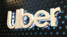Uber logo on the wall of an office