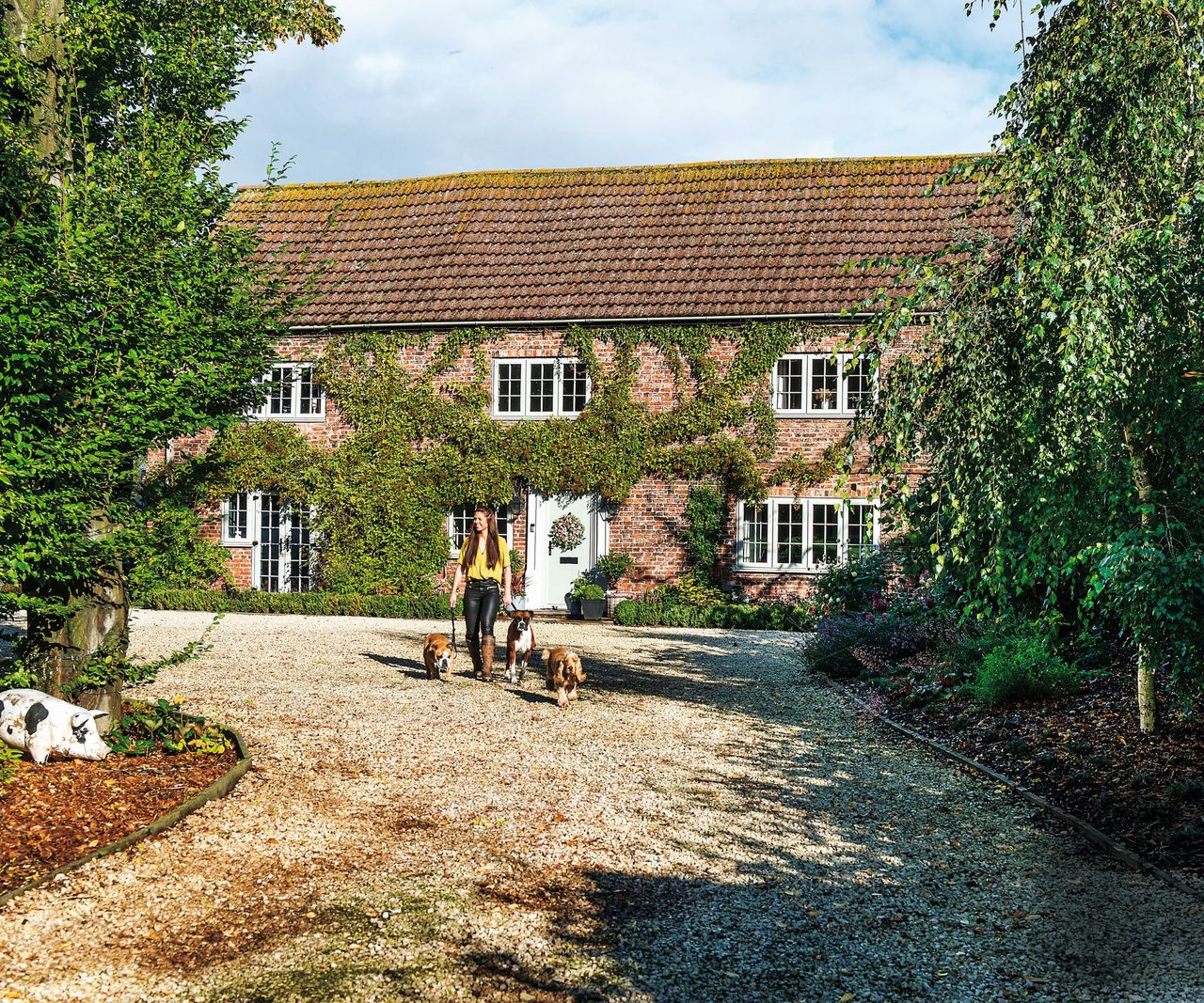 Brick house front, white windows and door