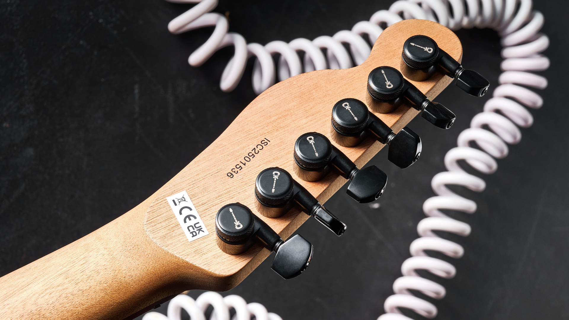 A set of locking tuners on the headstock of the Charvel Standard Series San Dimas Style 2 SD2 HH HT electric guitar