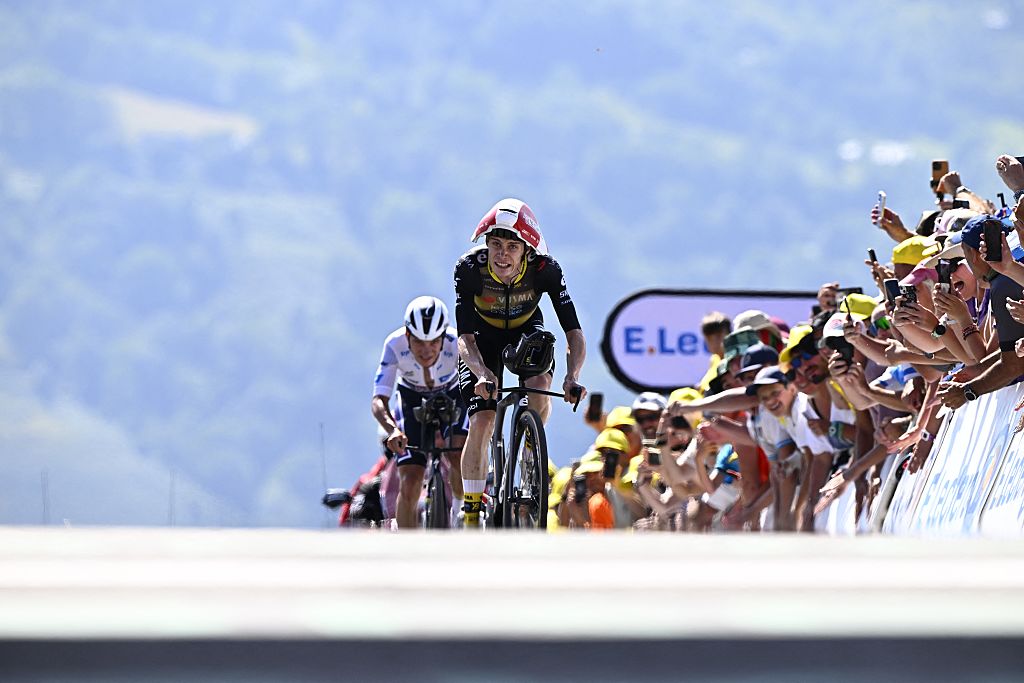 Belgian Remco Evenepoel of Soudal Quick-Step and Danish Jonas Vingegaard Hansen of Team Visma-Lease a Bike pictured at the finish of stage 13 of the 2025 Tour de France cycling race, an 11km individual time trial from Loudenvielle to Peyragudes, on Friday 18 July 2025 in France. The 112th edition of the Tour de France starts on Saturday 5 July in Lille, France, and will finish in Paris, France on the 27th of July. BELGA PHOTO JASPER JACOBS (Photo by JASPER JACOBS / BELGA MAG / Belga via AFP)
