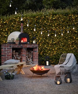 outdoor lighting festoons and hedge fairy lights from lights4fun with pizza oven