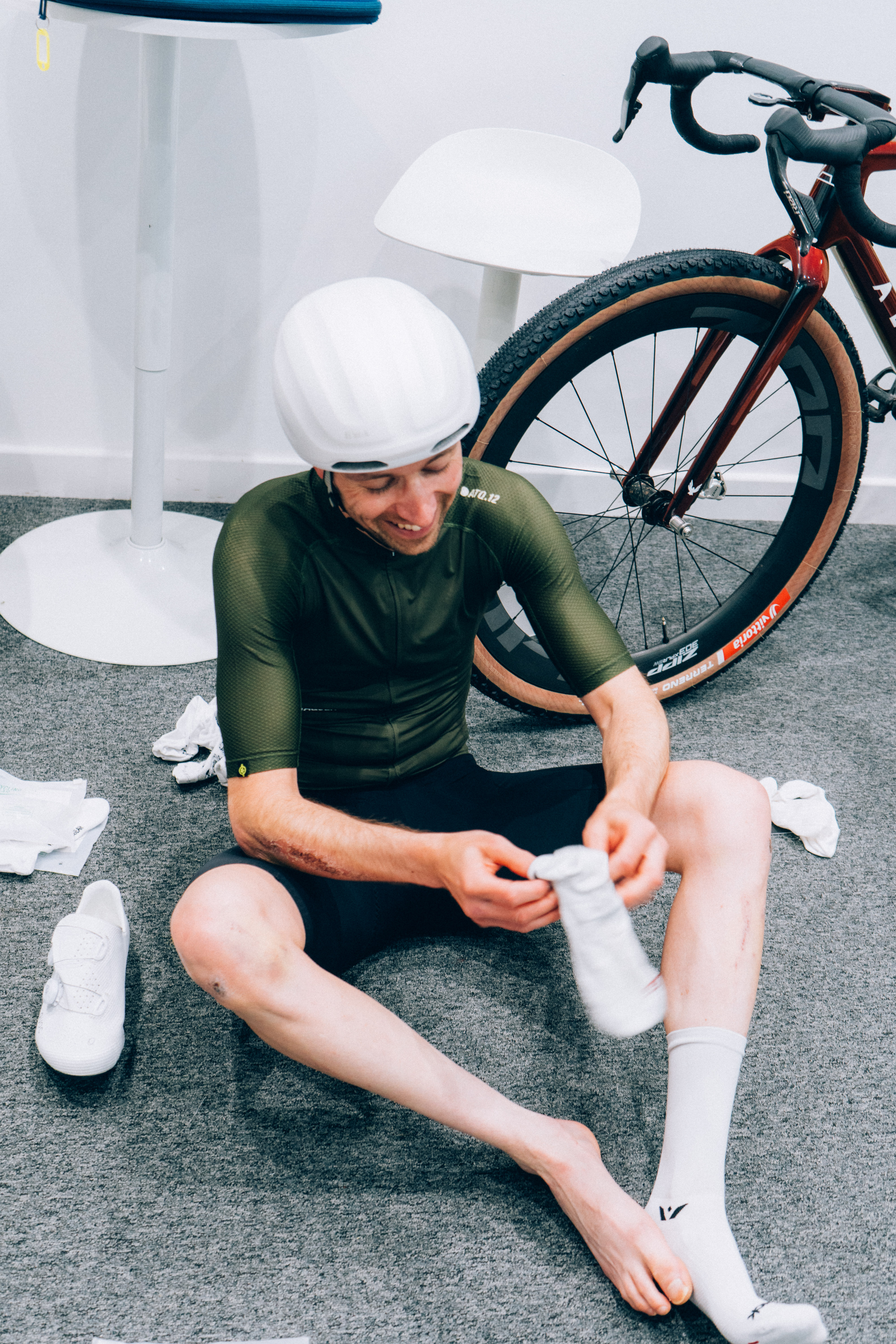 Rider putting socks and shoes on