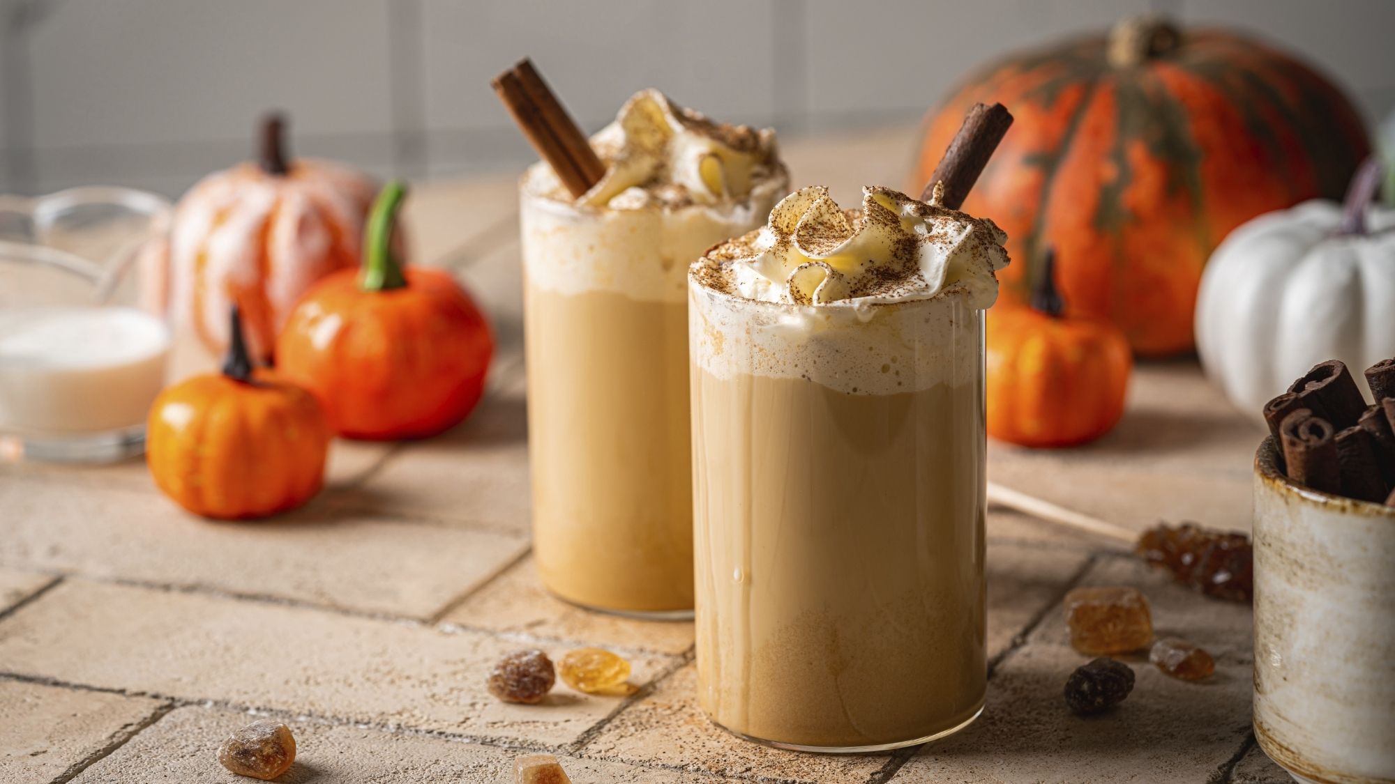 Autumn pumpkin spice latte with whipped cream and cinnamon