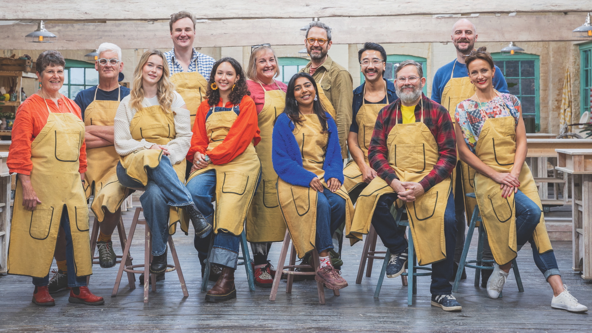 Contestants on series 8 of The Great Pottery Throw Down sit in the studio