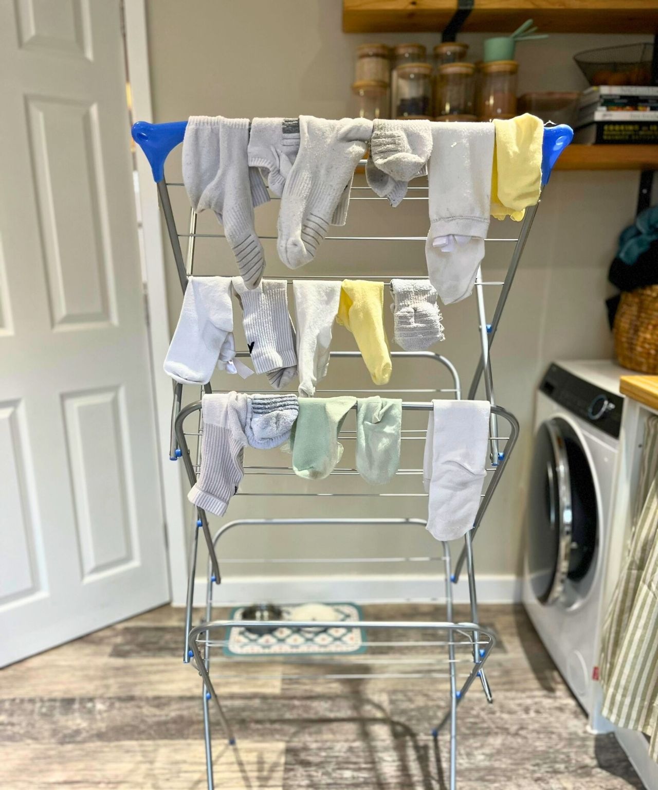 Three rails on my airer filled with socks