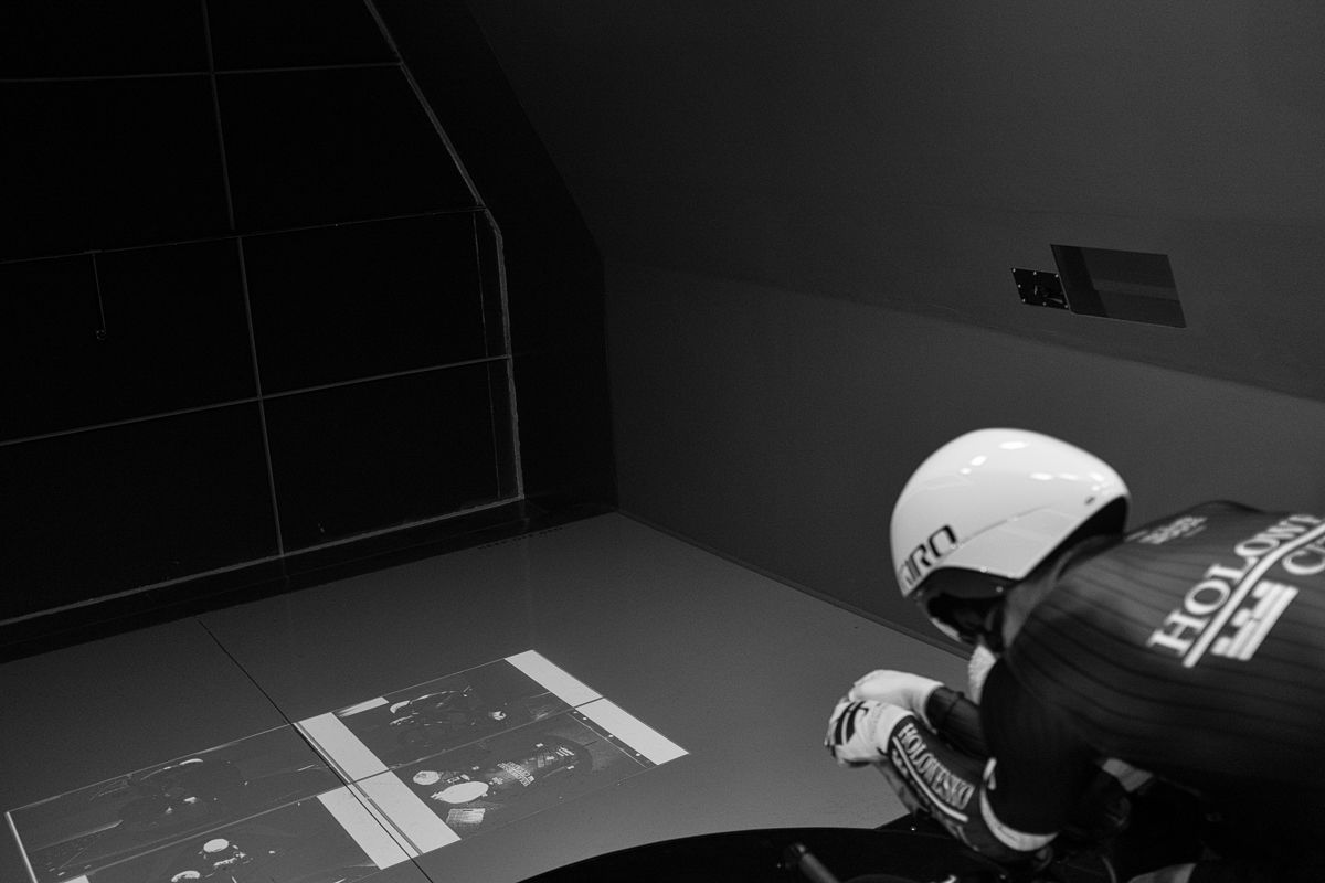 A rider looks at projected images of his own position during the test