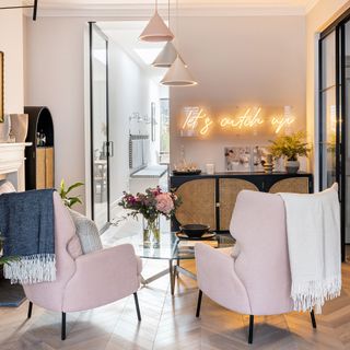 Two pink armchairs in a modern family home