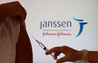 A vaccine in front of a Janssen/Johnson&Johnson logo.