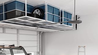 Overhead garage storage racks with boxes.