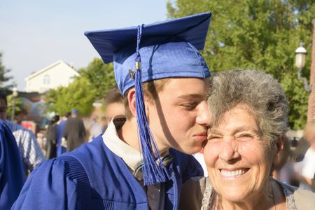A grandmother with her grandson at graduation.