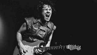 Gary Moore performing onstage in the mid-80s