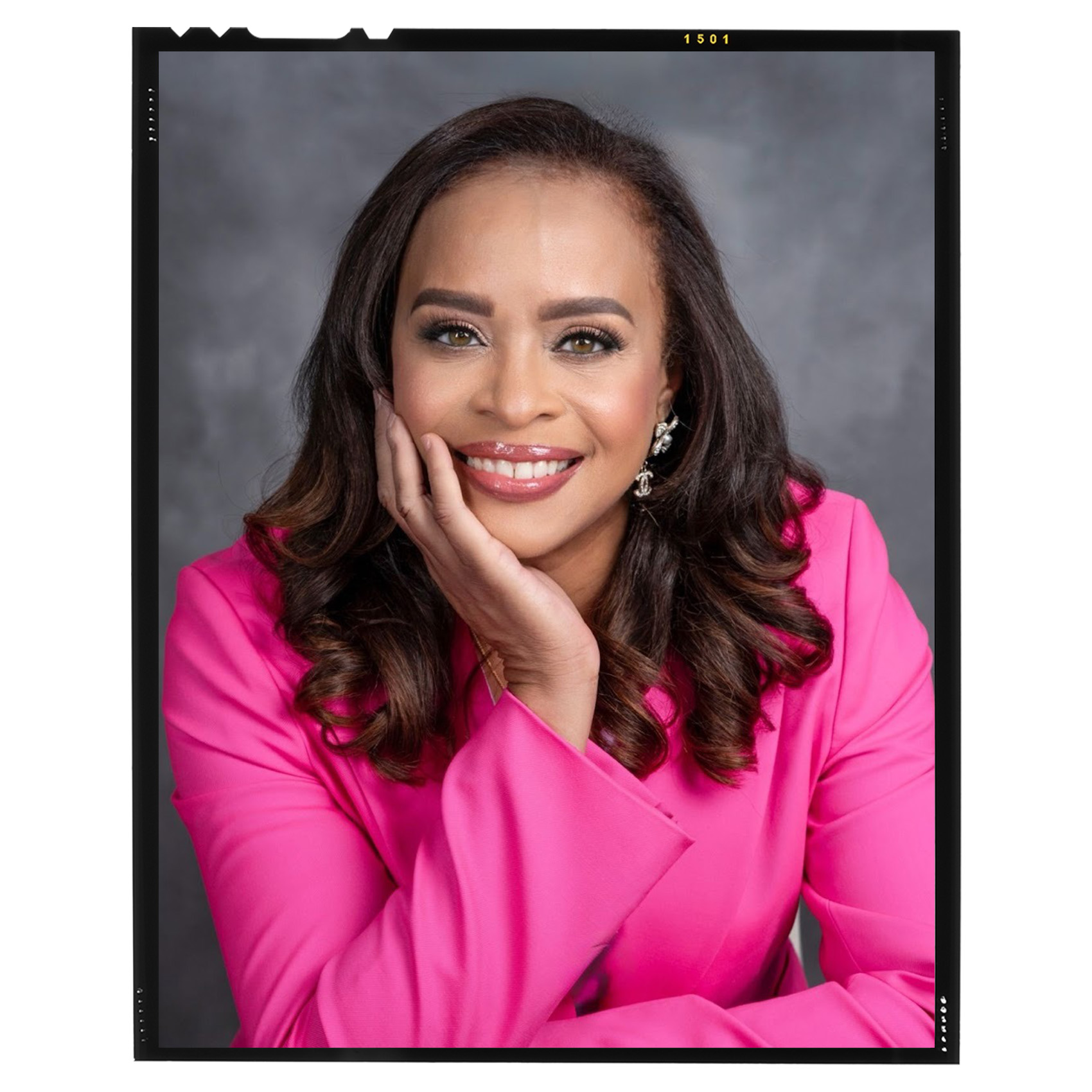 portrait of Melonie Parker in a pink blouse against a gray background