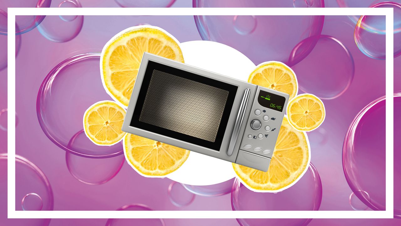 A microwave on a pink background with lemon slices around it.