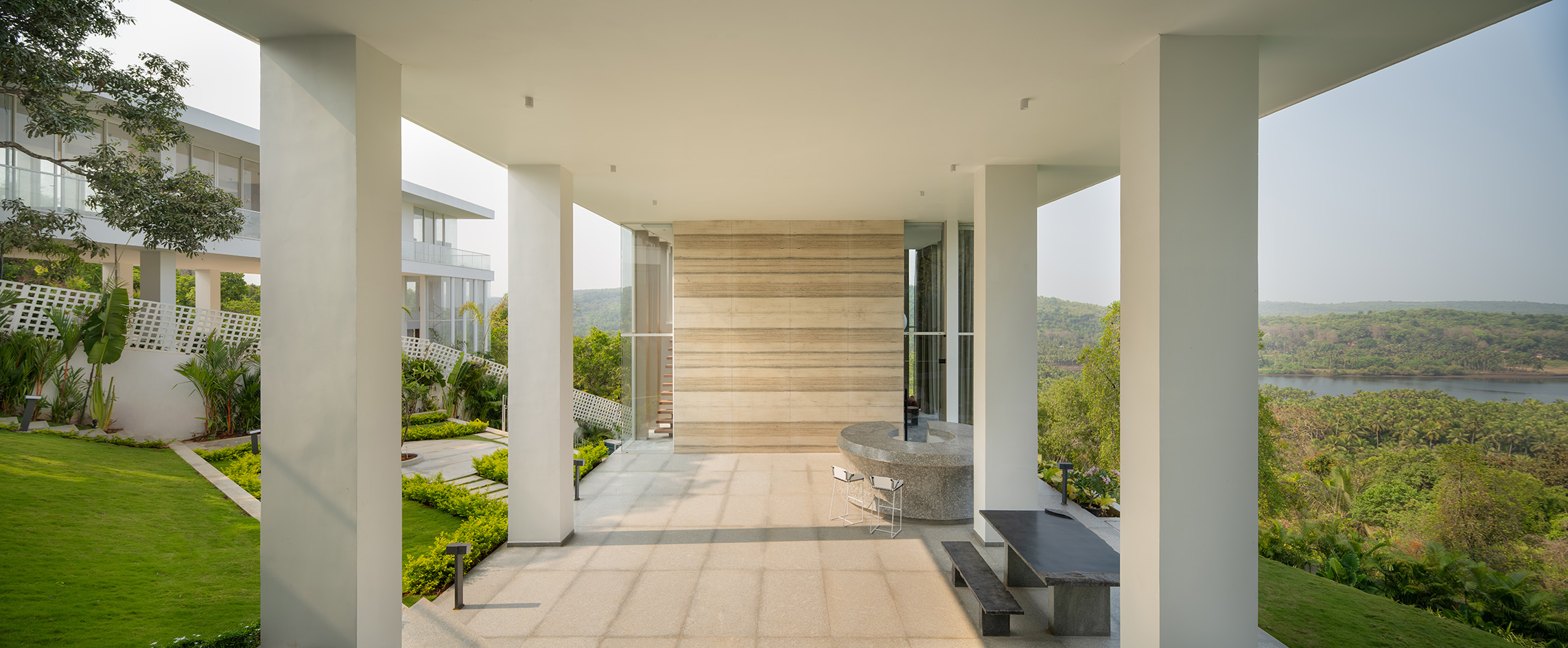 a white Goa villa in the leafy indian forest