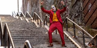 Joaquin Phoenix dancing on stairs as Joker