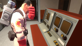 The Medic facepalms at a bank of computer screens.