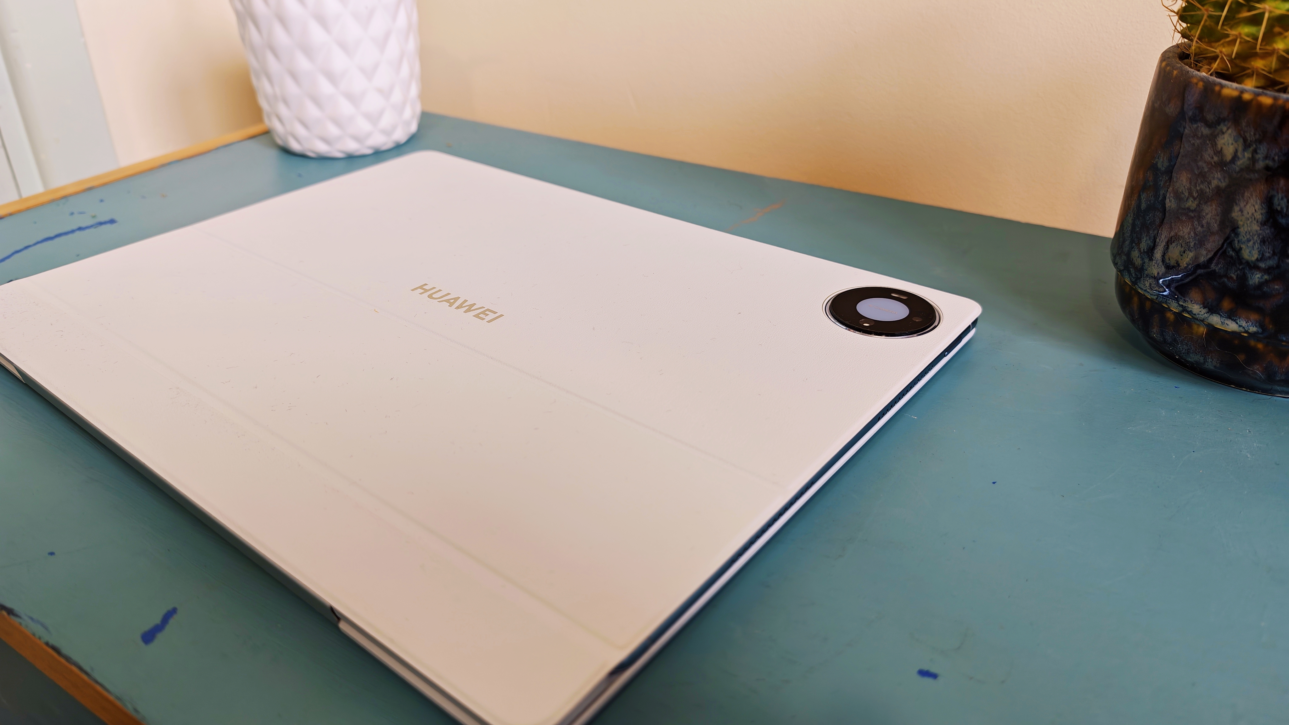 A Huawei MatePad Pro Max tablet on a blue-green table