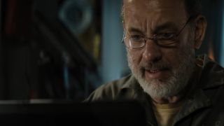 Tom Hanks working at a computer in Finch.