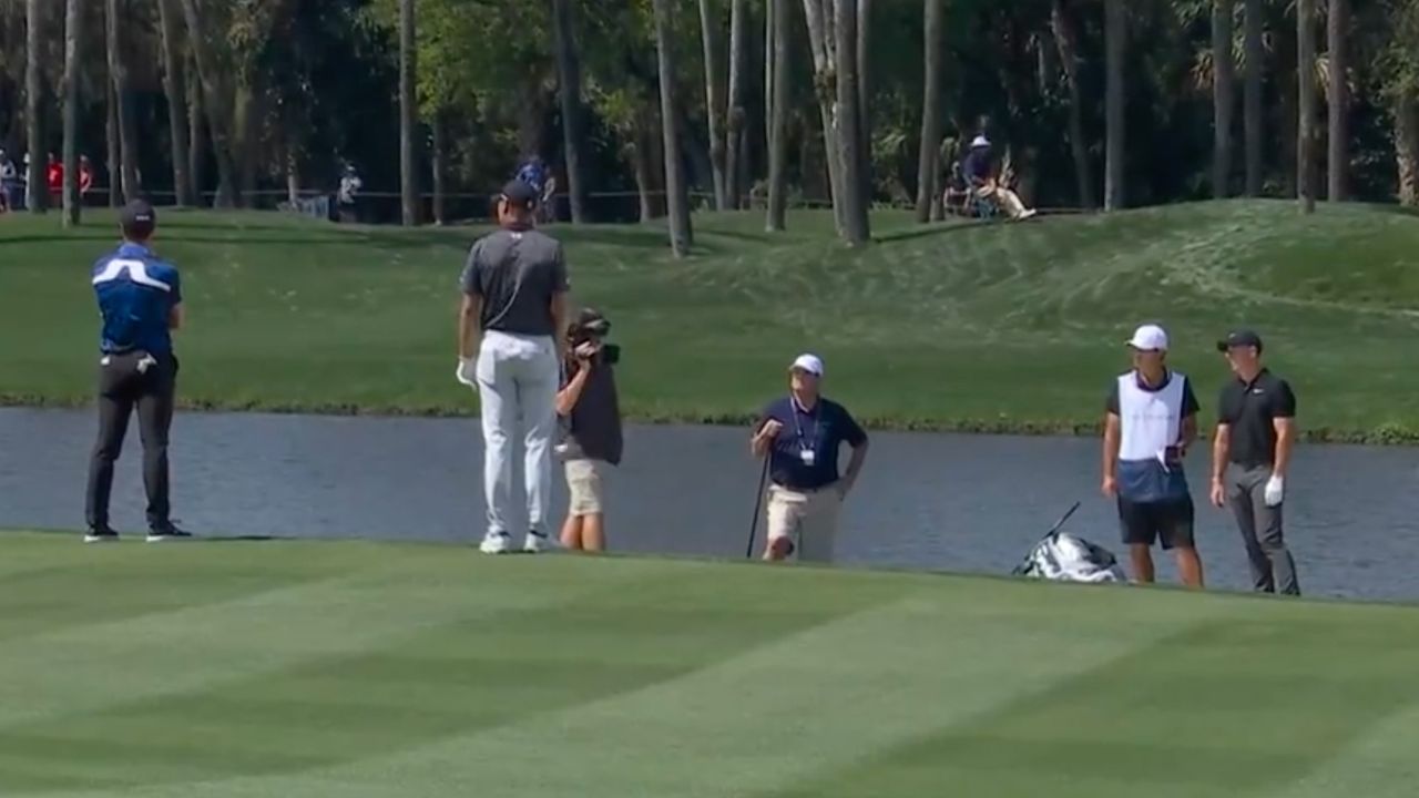 Screenshot of McIlroy, Spieth and Hovland in discussions over a ruling