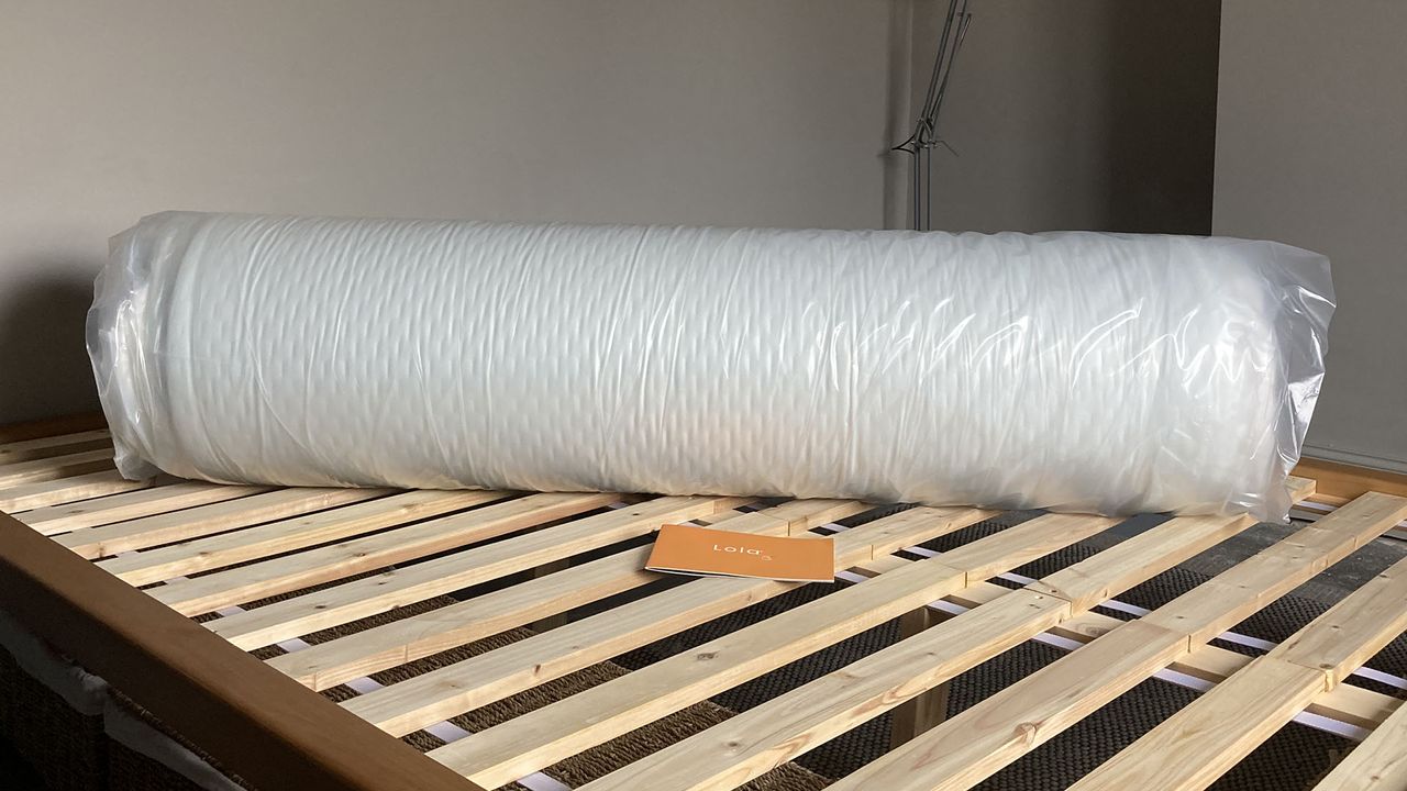 Lola Cool Hybrid mattress rolled and compressed in plastic