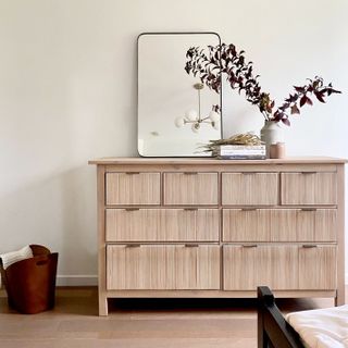 Wooden dresser with mirror on top