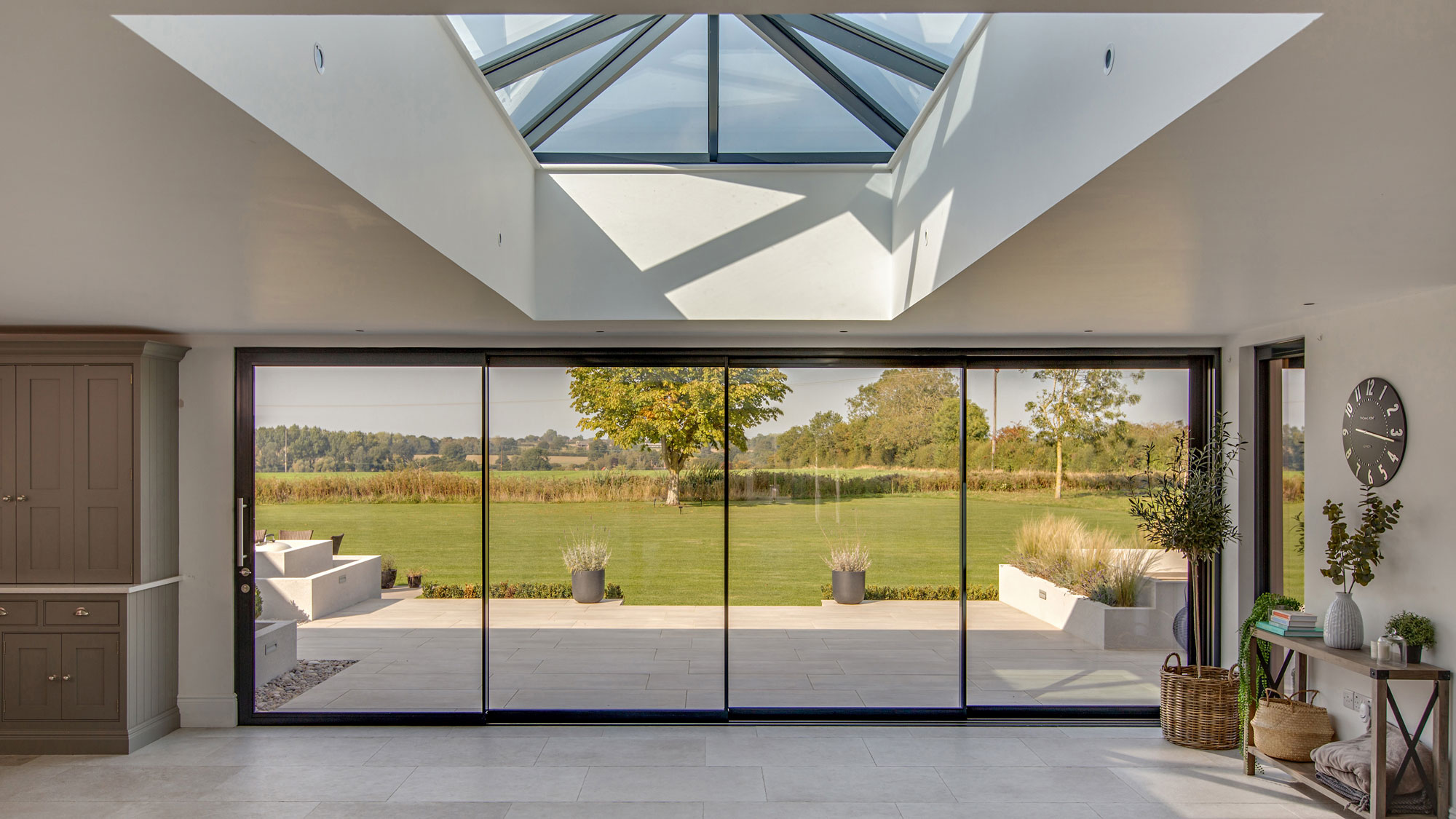 large roof lantern in modern space with sliding doors