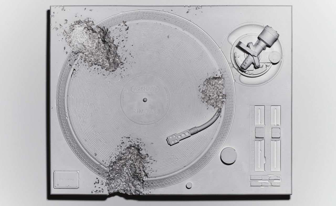 A grey turntable. 