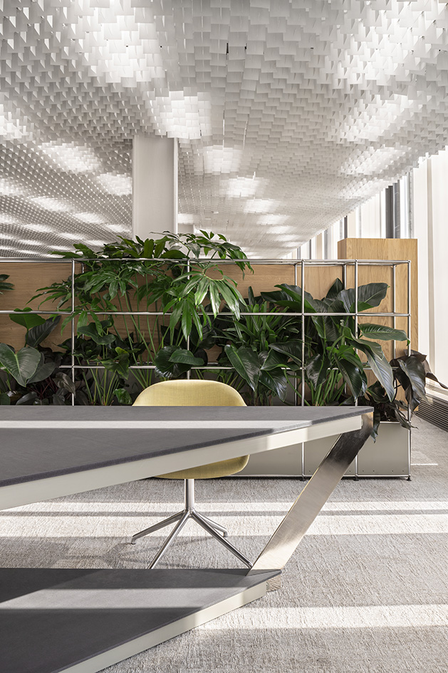 Palazzo Mondadori, modernist space originally designed by Oscar Niemeyer and seen here is the interior renovation by Carlo Ratti using recycled usm shelving