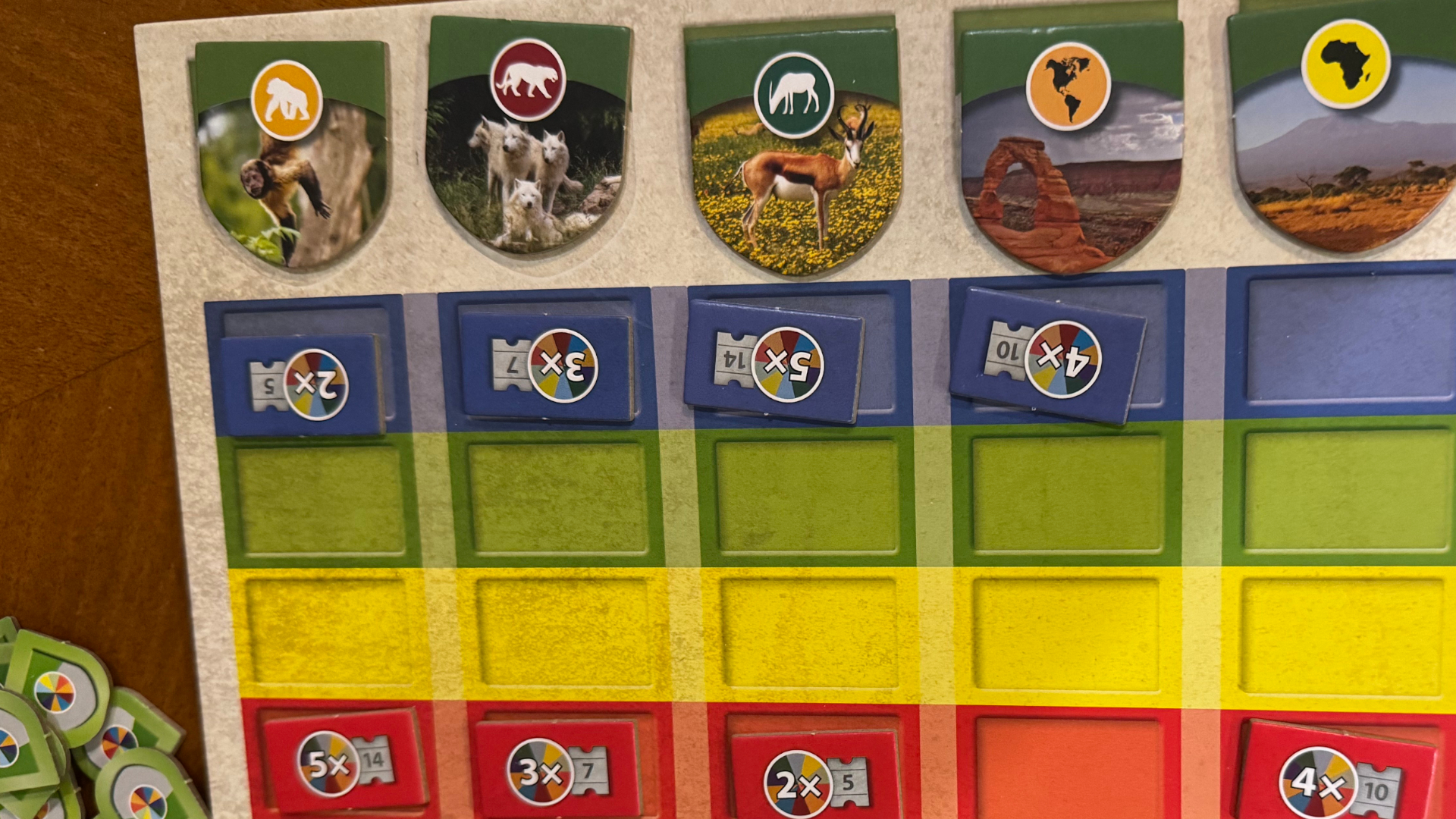 Sanctuary tokens laid out on a colorful board