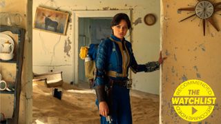 Lucy (Ella Purnell) in her Vault suit exploring a burned-out building the Fallout TV Show, with our yellow watchlist recommended badge in the bottom-right corner