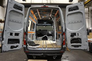 Image of a Mercedes Sprinter van undergoing a conversion at Adventure Wagon's HQ in Portland, OR.