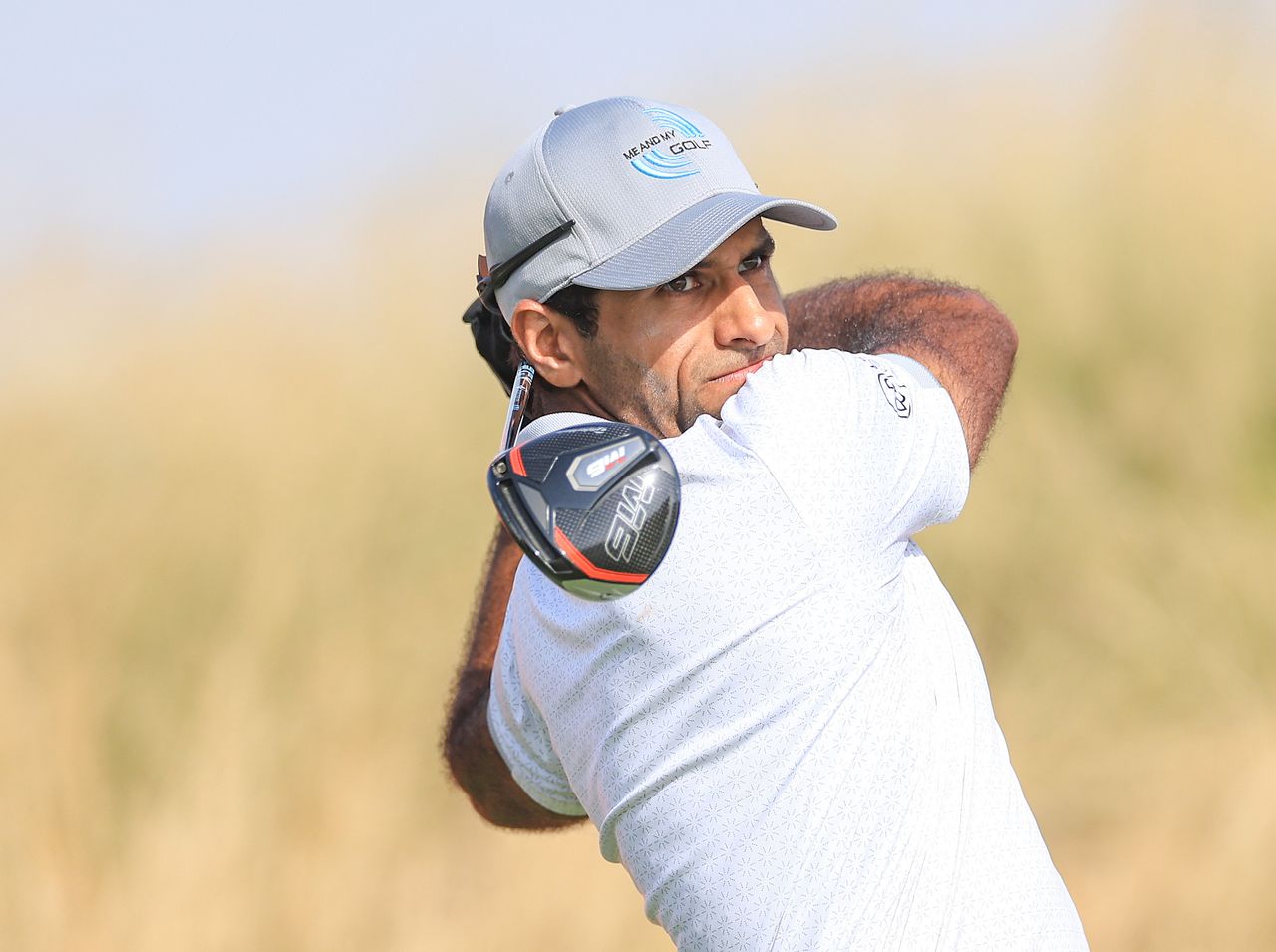 Aaron Rai strikes a driver off the tee