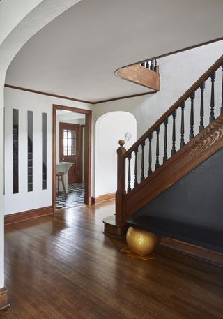A passageway with solid wood flooring