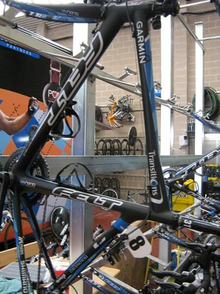 A race bike with dossard still intact.