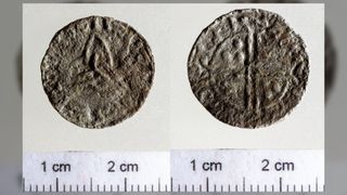 Side by side images of the front and back of the small silver Viking coin that was found. It looks very worn, but on one side you can make out the triquetra in the middle and writing going around the edge. The next image shows the other side of the coin. It is very worn but you can make out some small circles in the top left and bottom right as well as 2 lines going down the middle and writing around the edge.